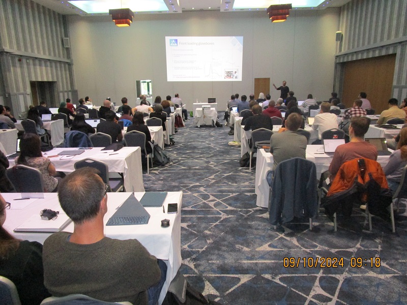 an image of an educational talk from the back of the room