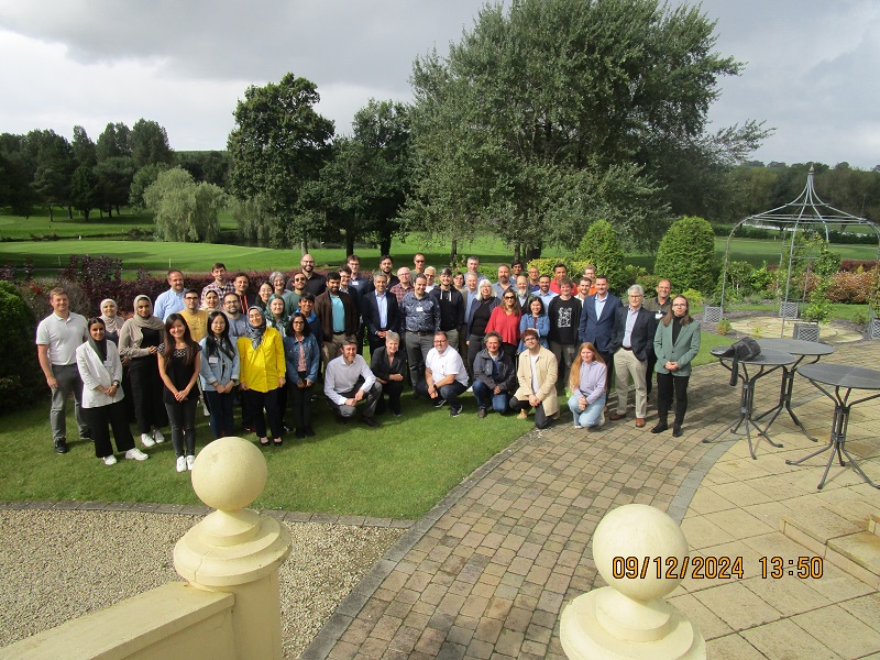 Attendees of talk gathering for a picture