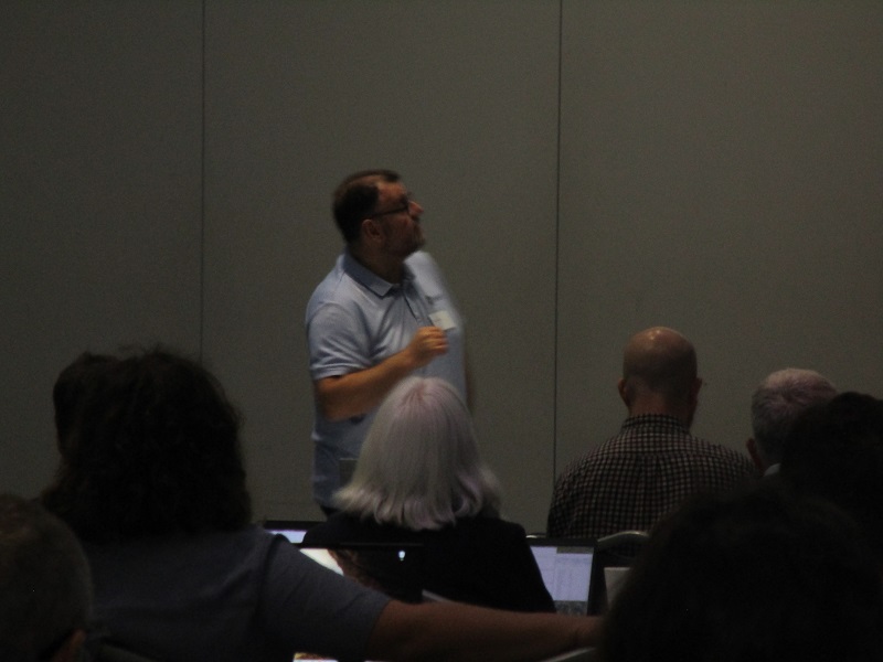 A speaker talking at an educational talk